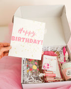 Gift box with birthday-themed items and a 'Happy Birthday!' card.