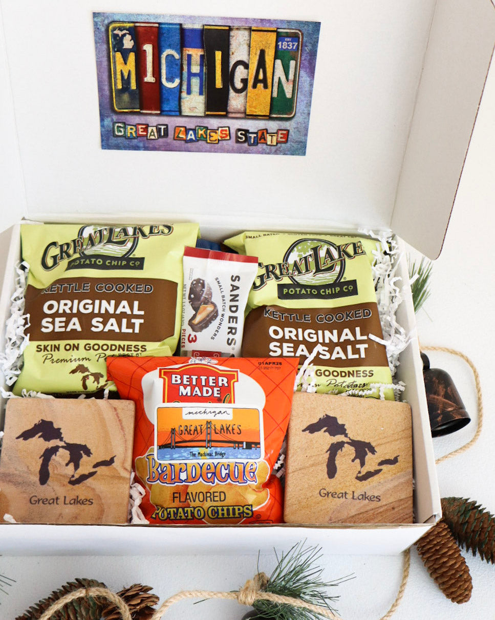 Box of potato chips with Michigan-themed packaging on a white surface.